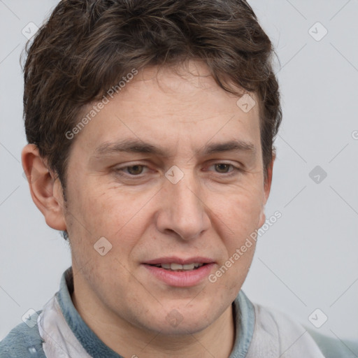 Joyful white adult male with short  brown hair and grey eyes