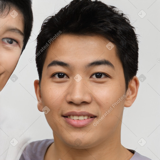 Joyful asian young-adult male with short  brown hair and brown eyes