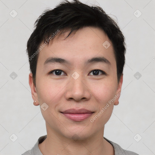 Joyful white young-adult male with short  black hair and brown eyes