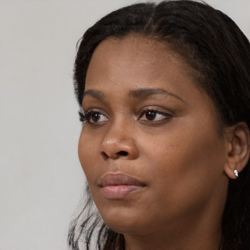 Neutral black young-adult female with long  black hair and brown eyes