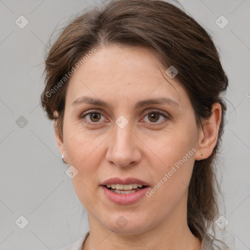 Joyful white adult female with medium  brown hair and grey eyes