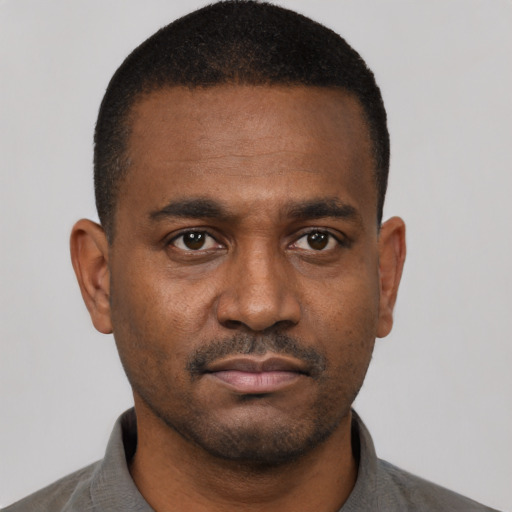 Neutral black young-adult male with short  black hair and brown eyes