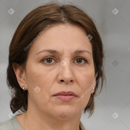 Joyful white adult female with medium  brown hair and grey eyes