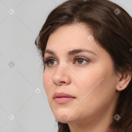 Neutral white young-adult female with long  brown hair and brown eyes