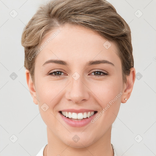 Joyful white young-adult female with short  brown hair and brown eyes