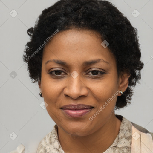 Joyful black adult female with short  brown hair and brown eyes