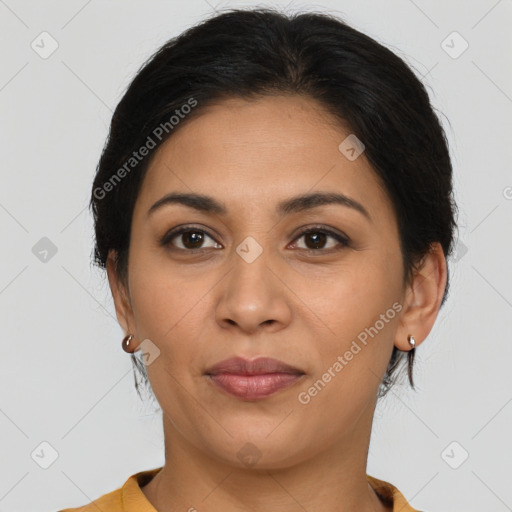 Joyful latino young-adult female with medium  brown hair and brown eyes