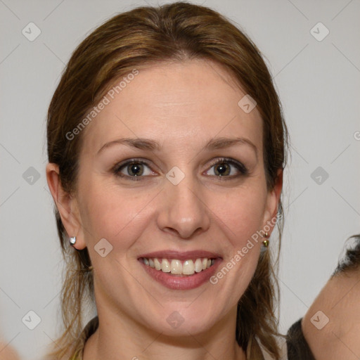 Joyful white young-adult female with long  brown hair and grey eyes