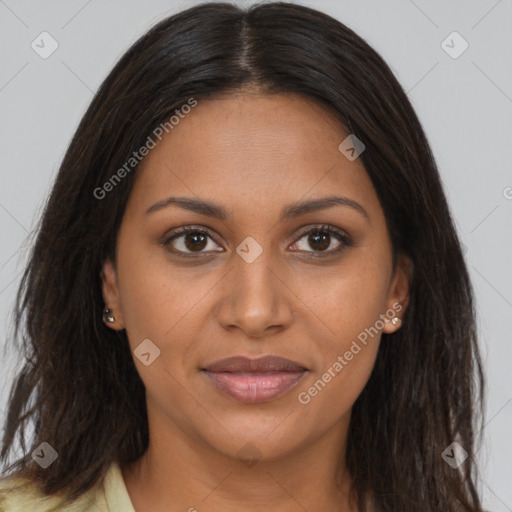 Joyful black young-adult female with long  brown hair and brown eyes