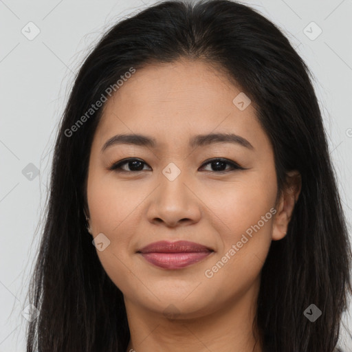 Joyful asian young-adult female with long  brown hair and brown eyes