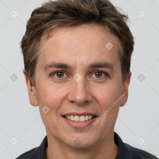 Joyful white adult male with short  brown hair and grey eyes