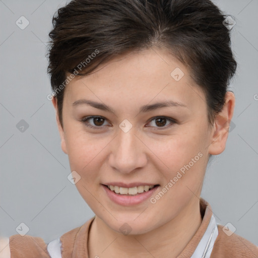 Joyful white young-adult female with short  brown hair and brown eyes