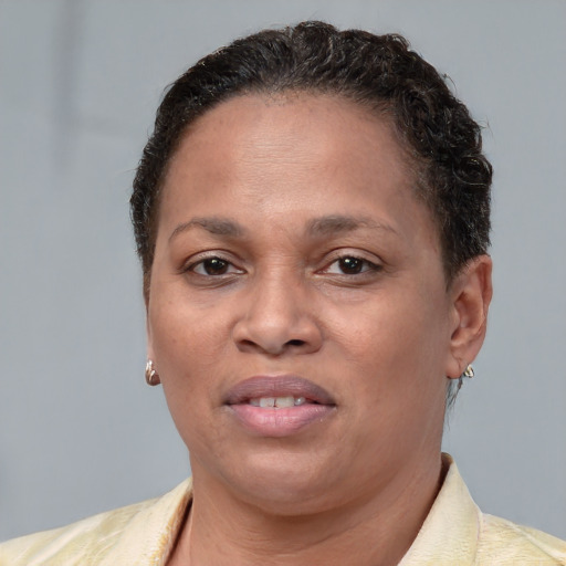 Joyful white adult female with short  brown hair and brown eyes