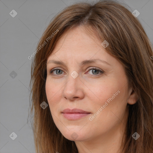 Joyful white adult female with long  brown hair and brown eyes