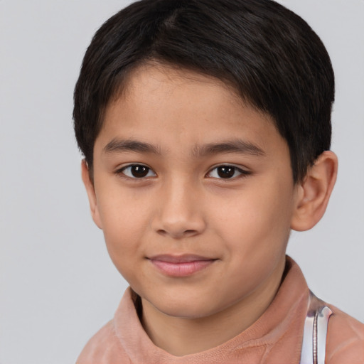 Joyful white child male with short  brown hair and brown eyes