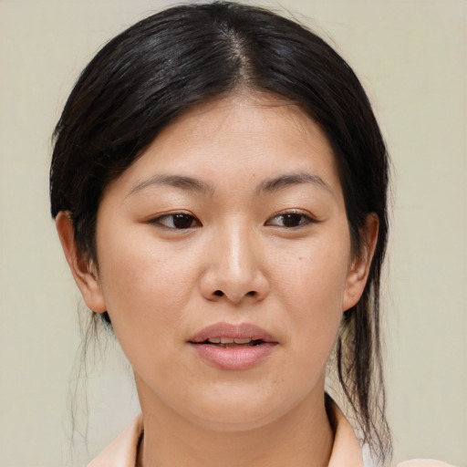 Joyful asian young-adult female with medium  brown hair and brown eyes