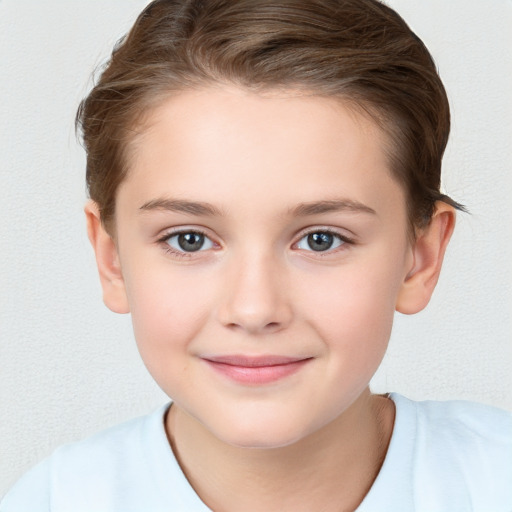 Joyful white child female with short  brown hair and brown eyes