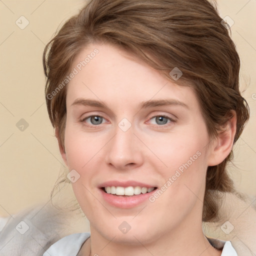 Joyful white young-adult female with medium  brown hair and blue eyes