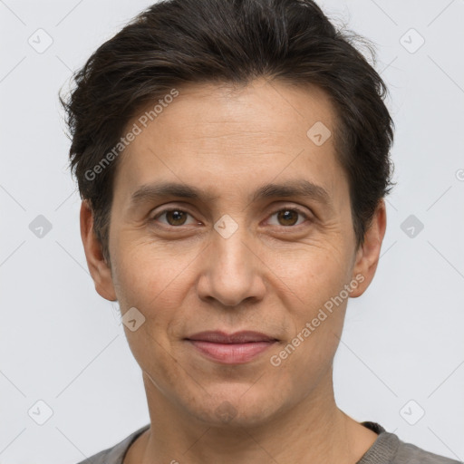 Joyful white adult male with short  brown hair and brown eyes