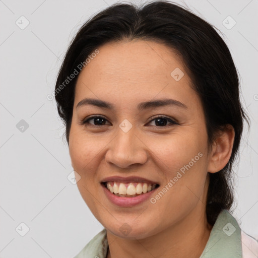 Joyful asian young-adult female with medium  brown hair and brown eyes