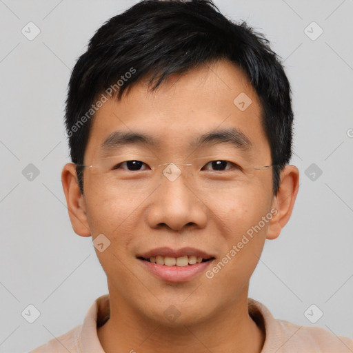 Joyful asian young-adult male with short  black hair and brown eyes