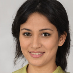 Joyful asian young-adult female with medium  brown hair and brown eyes