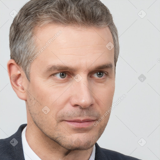 Neutral white adult male with short  brown hair and brown eyes