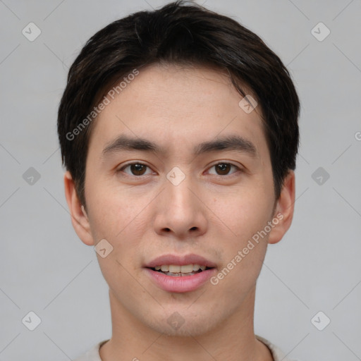 Joyful asian young-adult male with short  brown hair and brown eyes