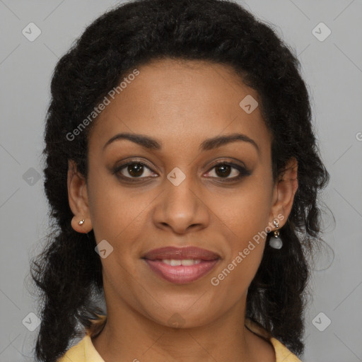 Joyful black young-adult female with long  brown hair and brown eyes