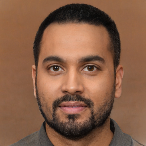 Neutral latino young-adult male with short  black hair and brown eyes