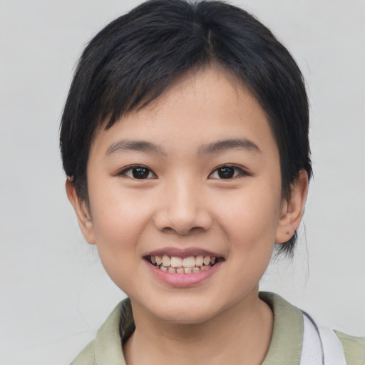 Joyful asian child female with medium  brown hair and brown eyes