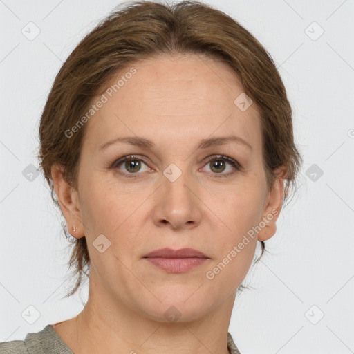 Joyful white adult female with medium  brown hair and grey eyes