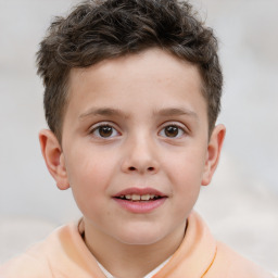 Joyful white child male with short  brown hair and brown eyes