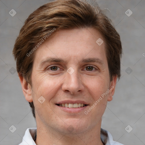 Joyful white adult male with short  brown hair and grey eyes