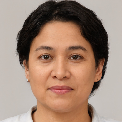 Joyful white adult female with medium  brown hair and brown eyes