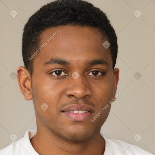 Joyful black young-adult male with short  brown hair and brown eyes
