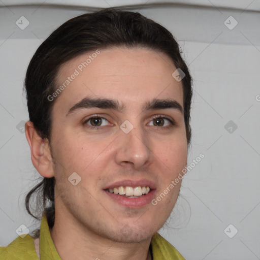 Joyful white young-adult male with short  brown hair and brown eyes