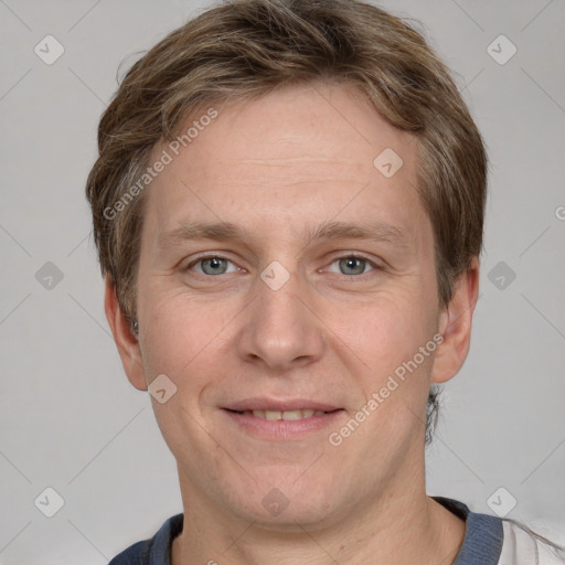 Joyful white adult male with short  brown hair and grey eyes