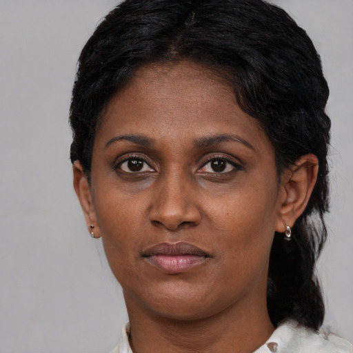 Neutral black adult female with short  black hair and brown eyes