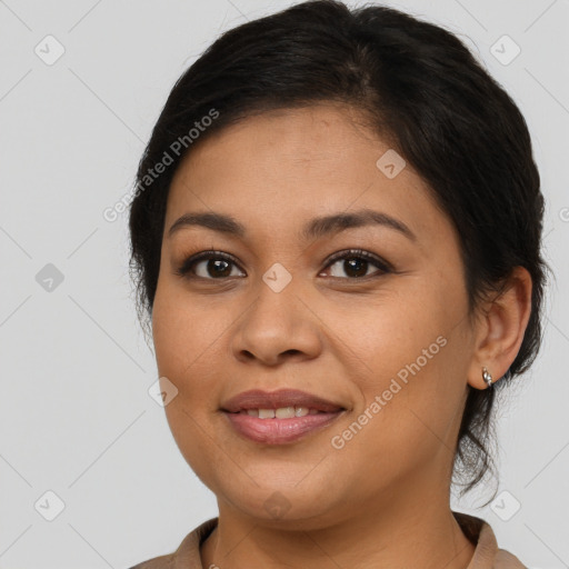 Joyful latino young-adult female with medium  brown hair and brown eyes