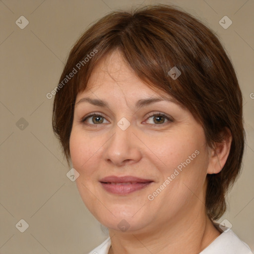 Joyful white adult female with medium  brown hair and brown eyes