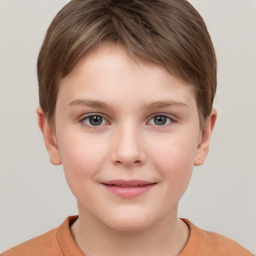 Joyful white child female with short  brown hair and brown eyes