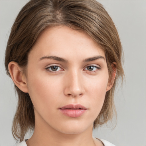 Neutral white young-adult female with medium  brown hair and brown eyes