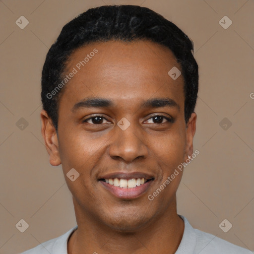 Joyful black young-adult male with short  black hair and brown eyes