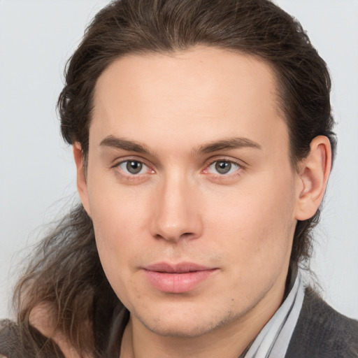 Joyful white young-adult male with medium  brown hair and brown eyes