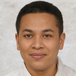 Joyful latino young-adult male with short  brown hair and brown eyes