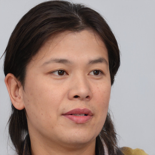Neutral asian young-adult female with medium  brown hair and brown eyes