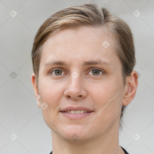 Joyful white young-adult female with short  brown hair and grey eyes