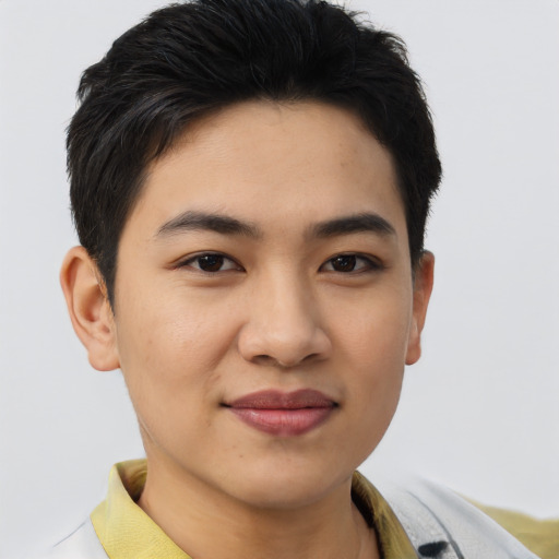 Joyful asian young-adult male with short  brown hair and brown eyes