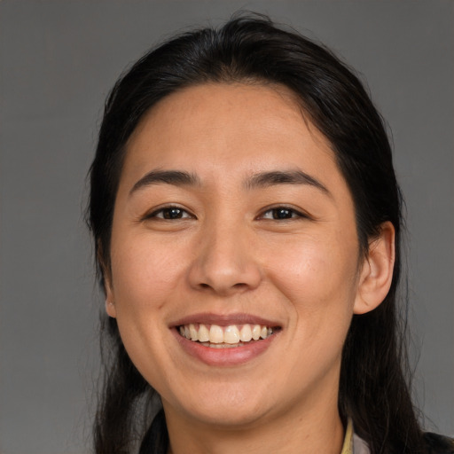 Joyful white young-adult female with medium  brown hair and brown eyes